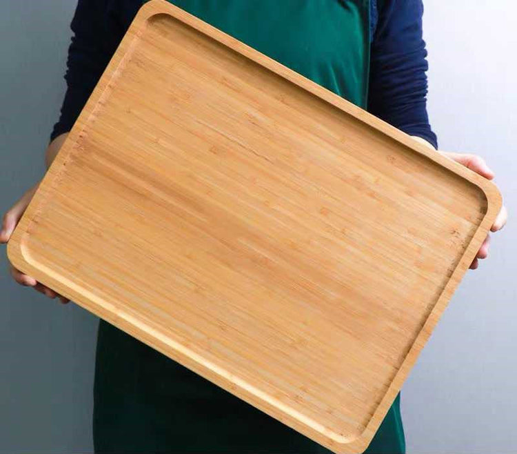 Rectangular bamboo wooden dinner tray by WoodyKitchenware, showing a natural grain finish and sturdy handles for household use.