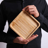 Rectangular bamboo wooden dinner plate tray from WoodyKitchenware, ideal for household serving and food presentation.