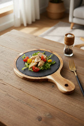 Black wood pizza dish from WoodyKitchenware, a wooden plate ideal for serving pizza with stylish rustic appeal.