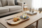 Black wood pizza dish from WoodyKitchenware, a stylish wooden plate for serving pizza and appetizers in elegant style.