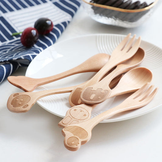 Cartoon wooden spoon and fork set for kids by WoodyKitchenware, playful dining utensils with colorful, child-friendly design.