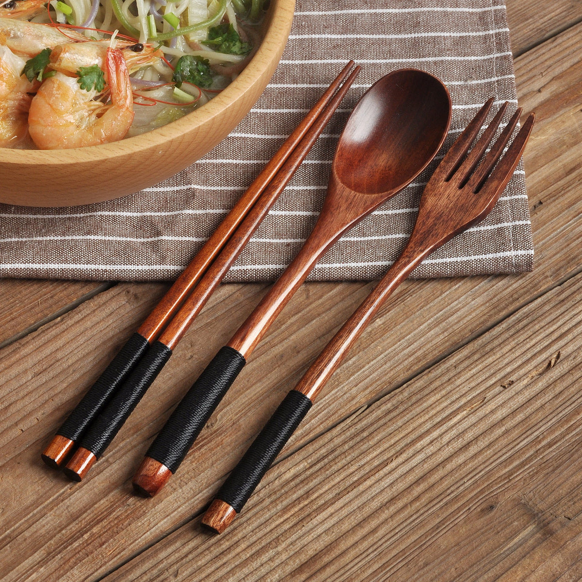 Set of colorful wooden spoons from WoodyKitchenware, eco-friendly Korean-inspired tableware with vibrant, natural wood finishes.
