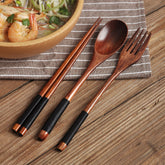 Set of colorful wooden spoons from WoodyKitchenware, eco-friendly Korean-inspired tableware with vibrant, natural wood finishes.
