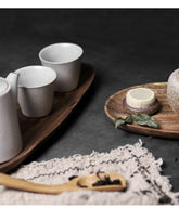 Handcrafted black walnut serving tray by WoodyKitchenware, irregular shape ideal for sushi, tea, fruits, and snacks.
