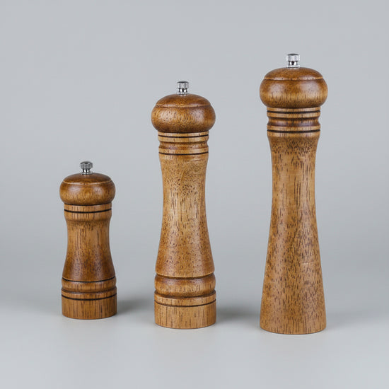 Manual wooden spice grinder by WoodyKitchenware with handcrafted ceramic mill and rustic wooden handle.
