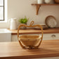 WoodyKitchenware folding fruit basket showcasing a natural wooden design, ideal for organizing fruits in a stylish home setting.