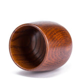 Hand-carved wooden kuksa mug from WoodyKitchenware, featuring detailed artisan craftsmanship and natural wood grain.