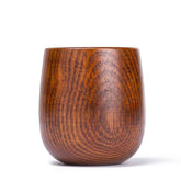 Hand-carved wooden kuksa cup from WoodyKitchenware, showcasing intricate artisan craftsmanship in natural wood finish.