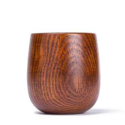 Hand-carved wooden kuksa cup from WoodyKitchenware, showcasing intricate artisan craftsmanship in natural wood finish.