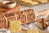 Wooden square embossed rolling pin with window grille pattern from WoodyKitchenware, showing detailed carved design on a light wood surface.