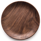 Black Walnut round breakfast tray by WoodyKitchenware, featuring smooth wood surface and sturdy handles for serving.
