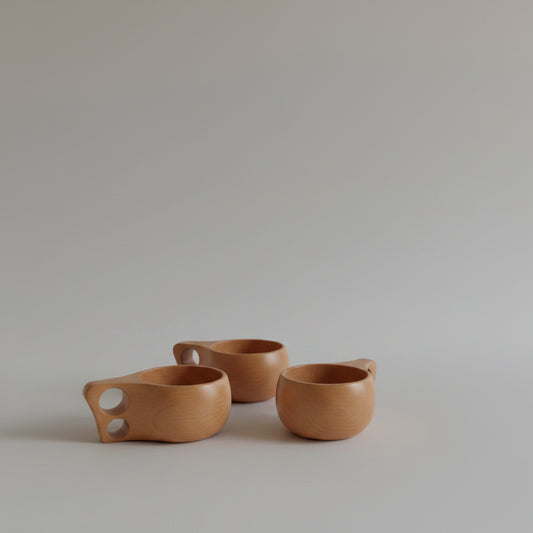 Hand-carved beechwood Kuksa cup from WoodyKitchenware, featuring a single-hole design and natural wood grain detail.