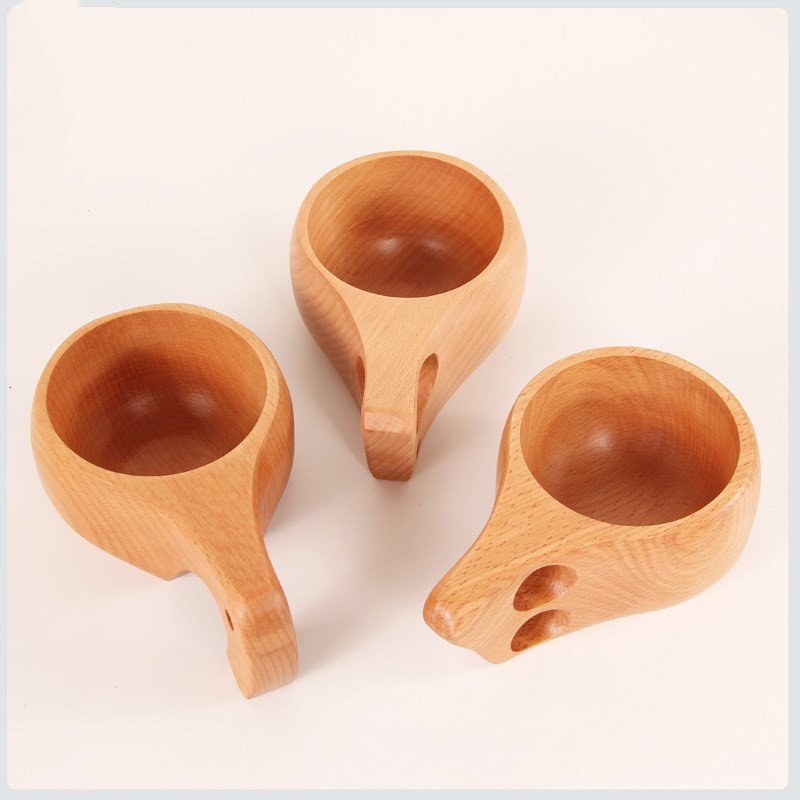 Hand-carved beechwood Kuksa cup from WoodyKitchenware, featuring a single-hole design and natural wood grain.