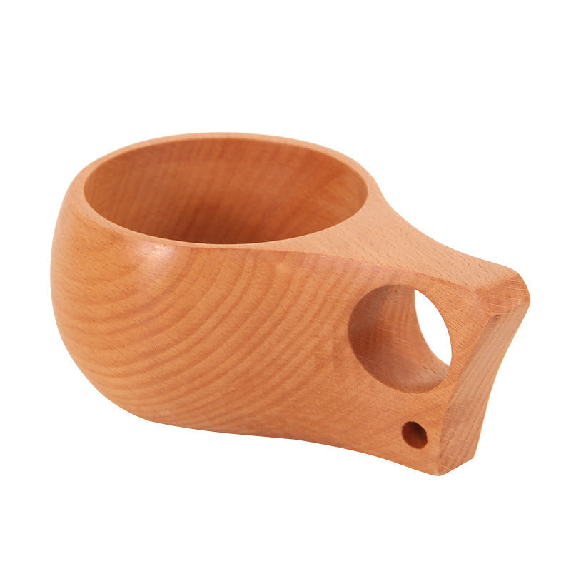 Hand-carved beechwood Kuksa cup by WoodyKitchenware, featuring a single-hole design and natural wood grain for rustic appeal.