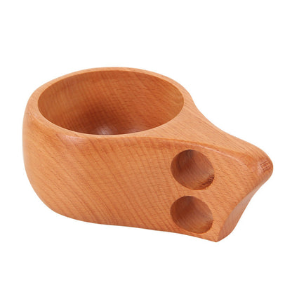 Hand-carved beechwood Kuksa cup from WoodyKitchenware, featuring a single-hole handle and natural wood grain.