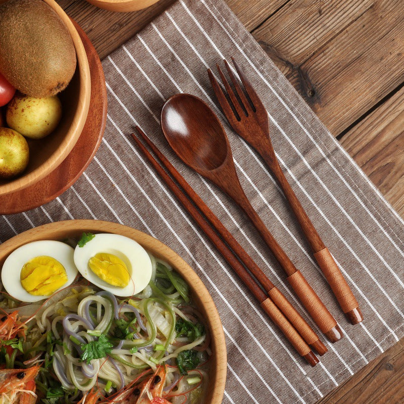 Black wooden long handle couple spoon and chopsticks set by WoodyKitchenware, portable tableware for travel and dining.