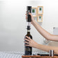 Black electric wine opener set by WoodyKitchenware with automatic corkscrew, foil cutter, and can opener, displayed on a wooden surface.