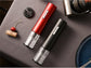 Black electric wine opener set by WoodyKitchenware with automatic corkscrew, foil cutter, and can opener displayed on a countertop.