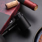 Black electric wine opener set by WoodyKitchenware with automatic corkscrew, foil cutter, and can opener on a sleek countertop.