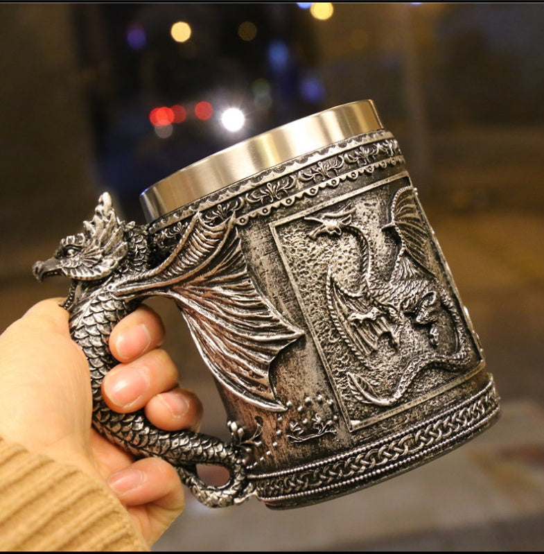 Sculpted silver dragon relic called The Drake's Talon by WoodyKitchenware, featuring detailed dragon design in a black background.