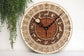 Handcrafted wooden astronomical clock by WoodyKitchenware featuring celestial details and a bronze finish, 30cm diameter.