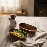 WoodyKitchenware acacia wooden canoe-shaped bowl, natural brown finish, perfect for serving or decorative table display.