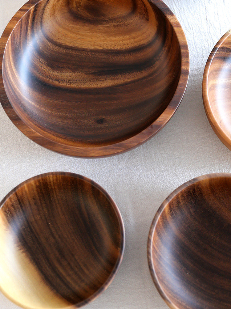 Natural wooden bowl from WoodyKitchenware, perfect for serving salads and snacks with rustic charm.