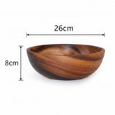 Natural wooden bowl from WoodyKitchenware, brown kitchenware for serving salads, fruits, or snacks in a rustic dining setting.