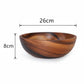 Natural wooden bowl from WoodyKitchenware, brown kitchenware for serving salads, fruits, or snacks in a rustic dining setting.