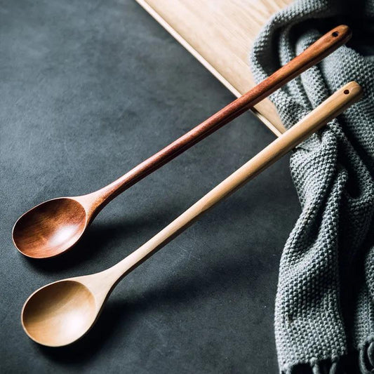 Wooden cooking spoon by WoodyKitchenware, extra-long handle ideal for stirring deep pots, made of smooth brown wood.