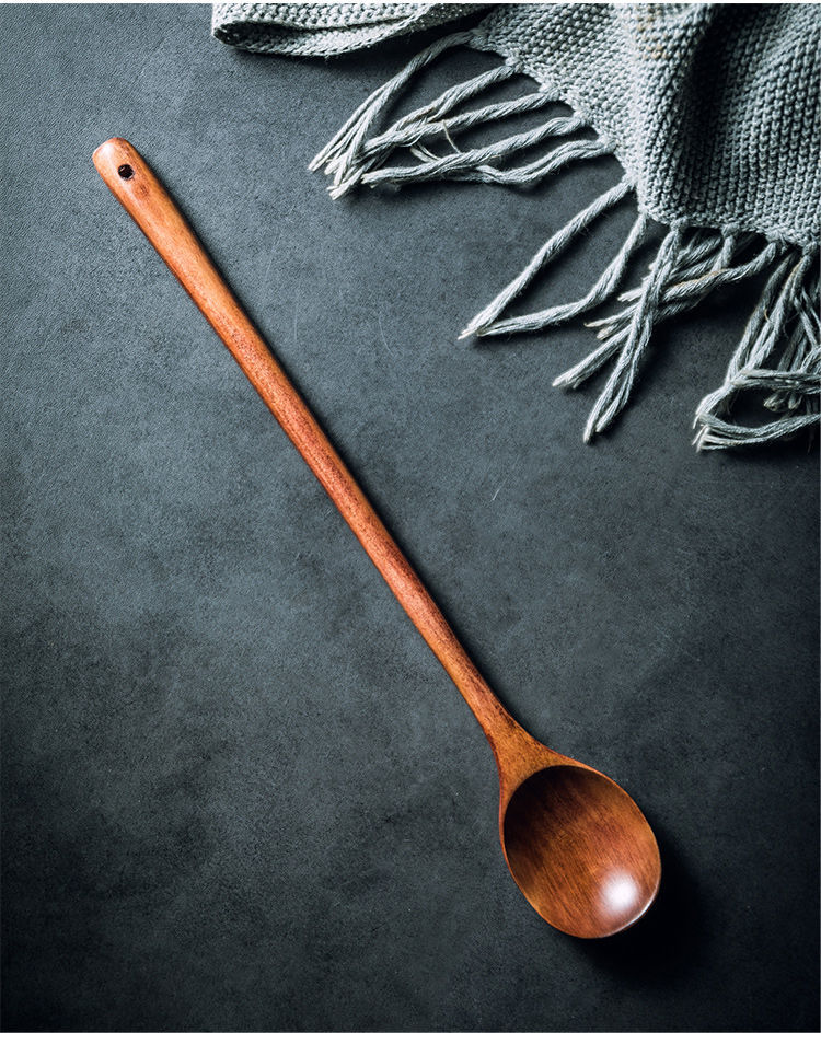 Extra-long wooden cooking spoon by WoodyKitchenware, ideal for stirring deep pots, with a smooth brown finish and ergonomic handle.