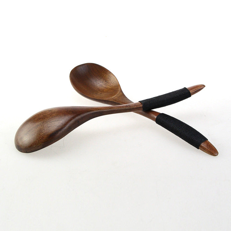 Set of three brown wooden spoons with tie wires from WoodyKitchenware, crafted by WoodyKitchenware, perfect for kitchen use.
