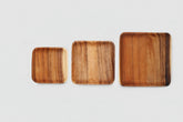 Rectangular acacia wooden plate by WoodyKitchenware with natural wood grain for elegant dining presentation.