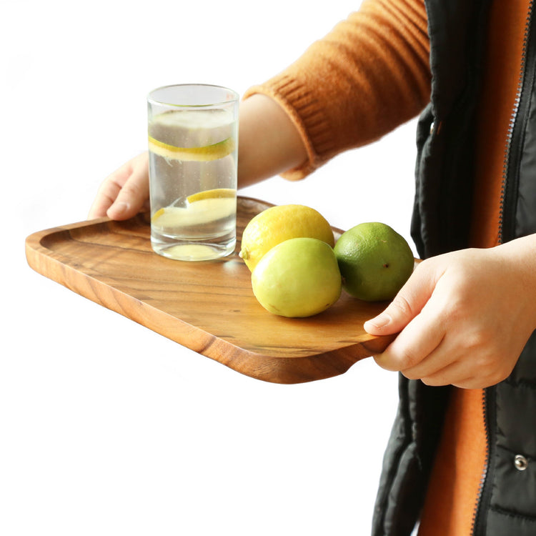 Rectangular wooden plate made of acacia wood from WoodyKitchenware, ideal for serving appetizers or salads.