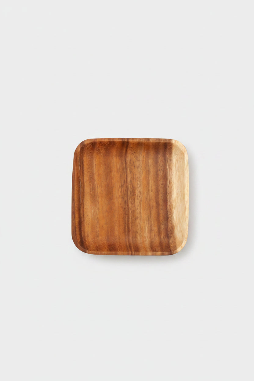 Rectangular acacia wooden plate by WoodyKitchenware, perfect for serving appetizers or main dishes in a stylish dining setting.