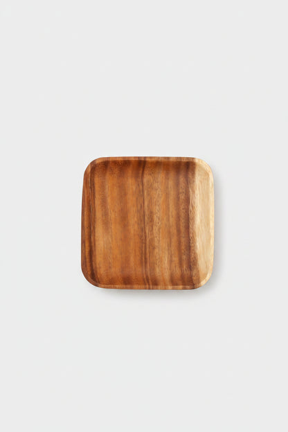 Rectangular acacia wooden plate by WoodyKitchenware, perfect for serving appetizers or main dishes in a stylish dining setting.