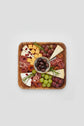 Rectangular acacia wooden plate from WoodyKitchenware with a smooth finish, ideal for serving appetizers or snacks in dining settings.