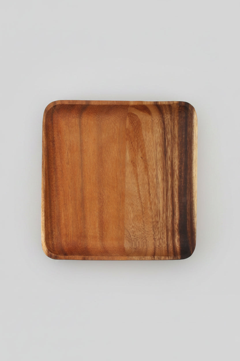 Rectangular wooden plate made of acacia wood from WoodyKitchenware, ideal for serving appetizers and enhancing dining presentation.
