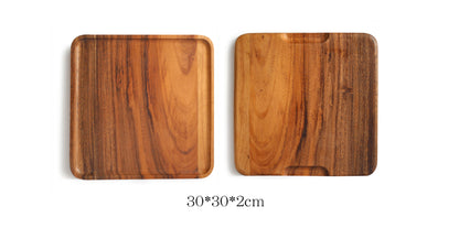 Rectangular wooden plate made of acacia wood from WoodyKitchenware, ideal for serving appetizers or main dishes.