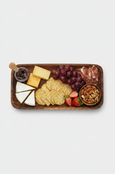 Rectangular wooden plate made of acacia wood from WoodyKitchenware, ideal for serving appetizers or snacks.