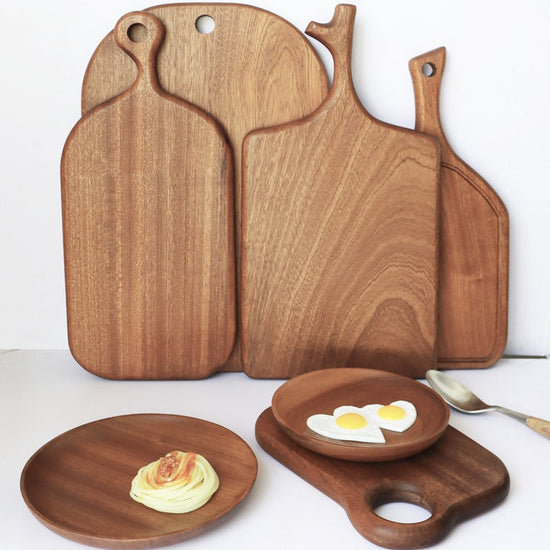 Solid wood vegetable cutting board by WoodyKitchenware with big handle, durable and eco-friendly kitchen essential.