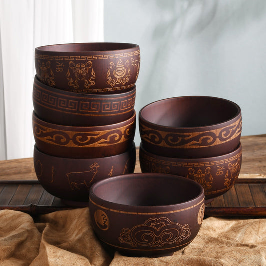 Carved wooden bowl with cattle, horse, and sheep motifs by WoodyKitchenware, showcasing intricate craftsmanship and natural timber.