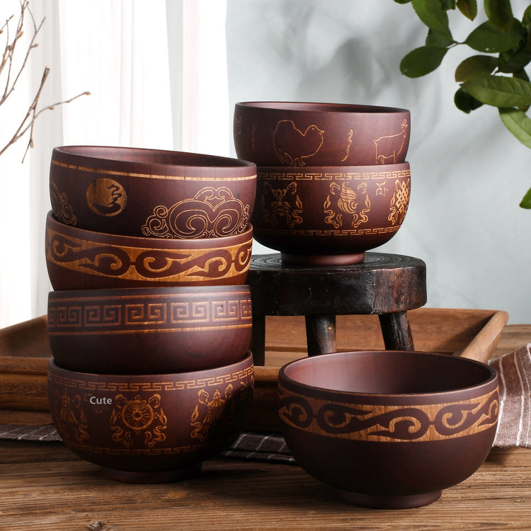 Carved wooden bowl featuring cattle, horse, and sheep designs by WoodyKitchenware, made from solid timber for rustic appeal