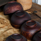 Carved wooden bowl with cattle, horse, and sheep designs by WoodyKitchenware, made from solid timber for decorative or functional use.