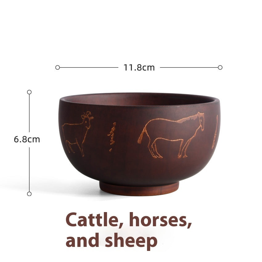 Carved wooden bowl featuring cattle, horse, and sheep designs by WoodyKitchenware in solid timber, Heritage Blessing collection.