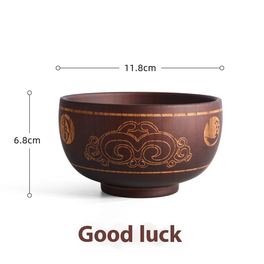 Carved wooden bowl with cattle, horse, and sheep designs from WoodyKitchenware Heritage Blessing collection, made of solid timber.