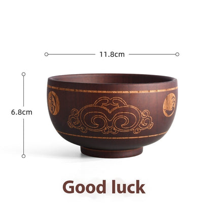 Carved wooden bowl with cattle, horse, and sheep designs from WoodyKitchenware Heritage Blessing collection, made of solid timber.