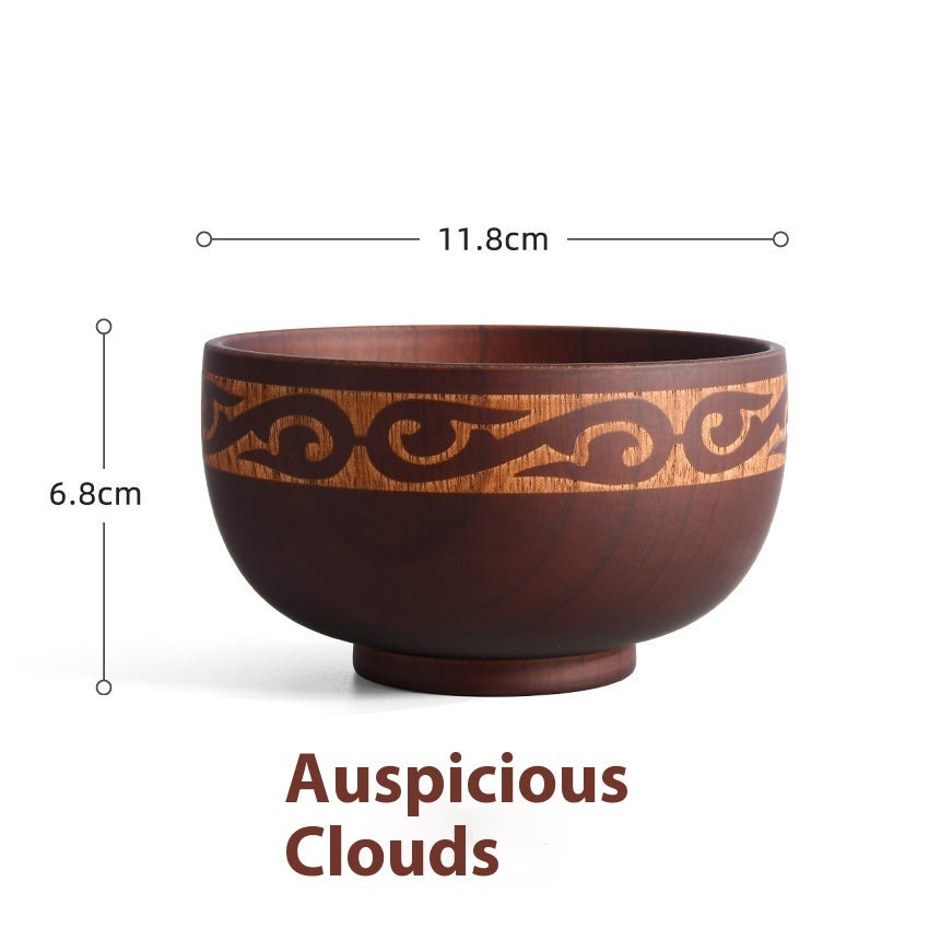 Carved wooden bowl with cattle, horse, and sheep motifs from WoodyKitchenware Heritage Blessing collection, made of solid timber.