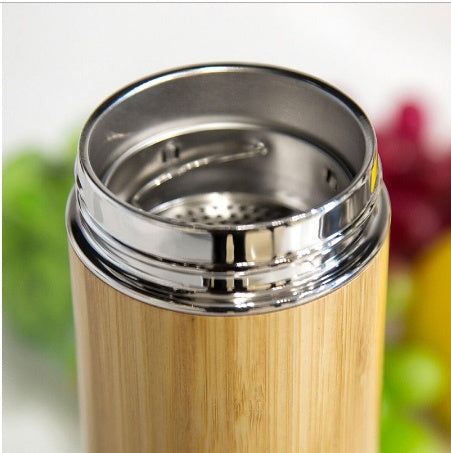 Hand-finished bamboo and steel vessel from WoodyKitchenware, The Zen Infuser, featuring sleek, natural design for tea brewing.