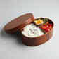 Round brown wooden bento box by WoodyKitchenware, traditional Japanese lunch box made of natural wood for stylish meal storage.